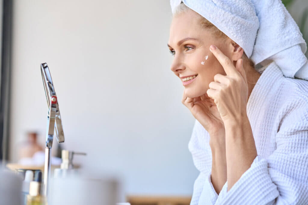 woman applying lotion