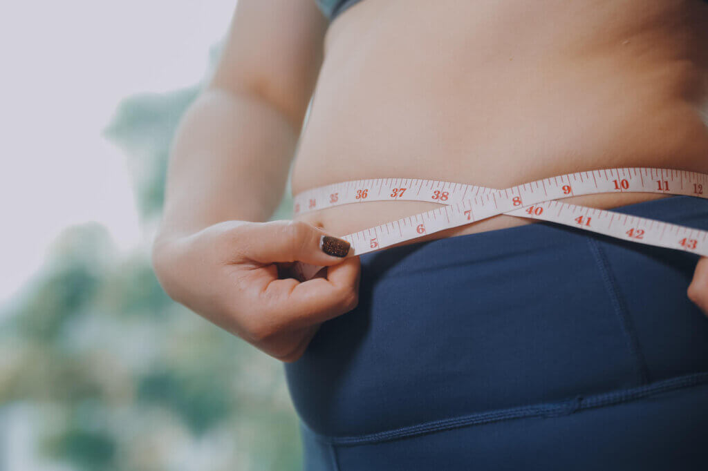 obese woman hand holding excessive