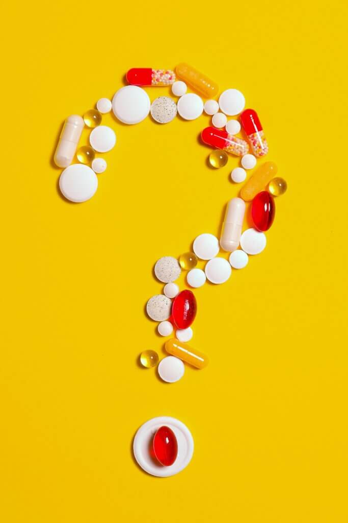 question mark with pills